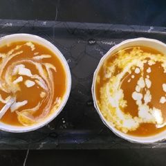 A picture of Tomato and carrot soup.