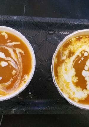 A picture of Tomato and carrot soup.