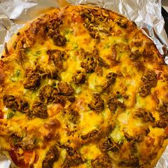 A picture of Crispy Chicken tikka Pizza.