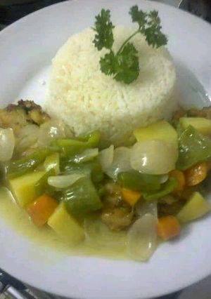 A picture of Rice and vegetable sauce.