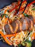 Stir fried egg noodles with roasted duck in sweet chilli plum sauce