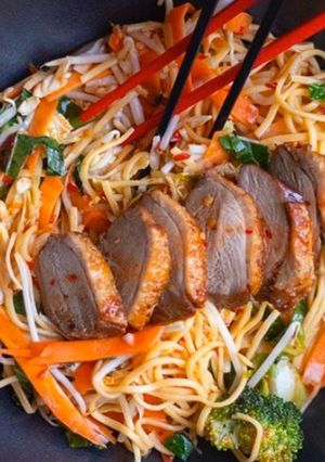 A picture of Stir fried egg noodles with roasted duck in sweet chilli plum sauce.
