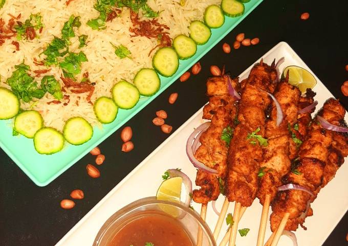 Chicken satay with peanut sauce and mixed vegetable rice