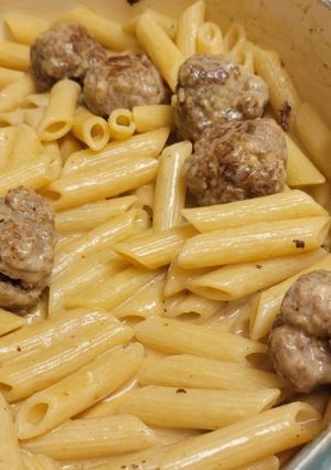 A picture of Penne with pork meatballs.
