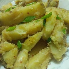 A picture of Garlic buttery potato wedges.