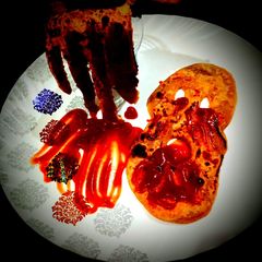A picture of Halloween paratha monster and hand.