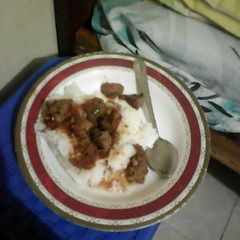 A picture of White rice and beef stew.