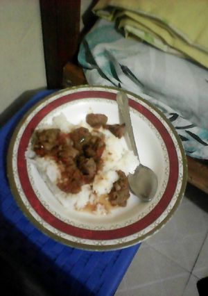 A picture of White rice and beef stew.
