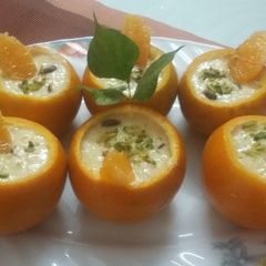 A picture of Firni with fresh kinnu jelly in kinnu shell.