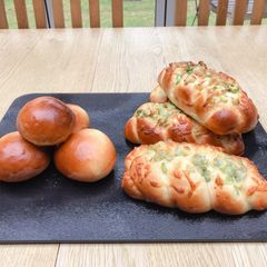 A picture of Spring onion & cheese braided bread and Nutella bread.
