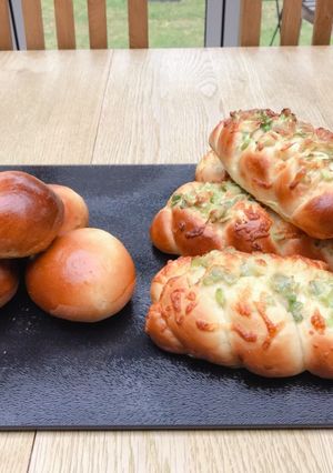 A picture of Spring onion & cheese braided bread and Nutella bread.