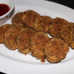 A picture of Maharashtrian style Kothimbir vadi/Coriander Fritters/Dhaniya Rolls.