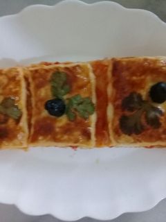 صورة لوصفة كوكا بالعجينة المورقة