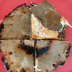 A picture of Pearl millet flour garlic - cheesy rotla.