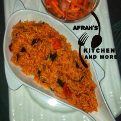A picture of Jollof rice with carrots sauce.