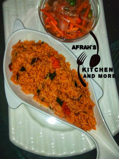 A picture of Jollof rice with carrots sauce.