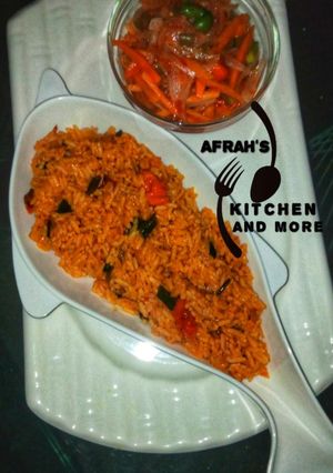 A picture of Jollof rice with carrots sauce.