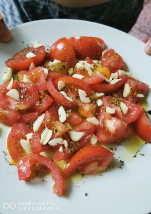 Una foto de Tomates aliñados