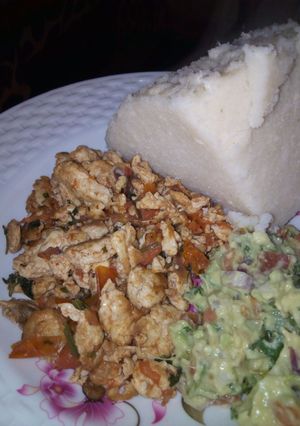 A picture of Scrambled eggs and guacamole.