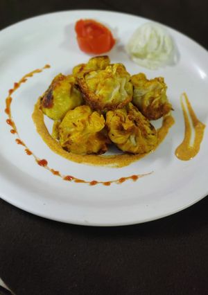 A picture of Garlic fried tandoori veg momos.