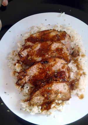 A picture of Pork Tenderloin w/ Garlic rice.