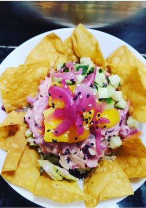 A picture of Coleslaw poke bowl with crispy corn chips.