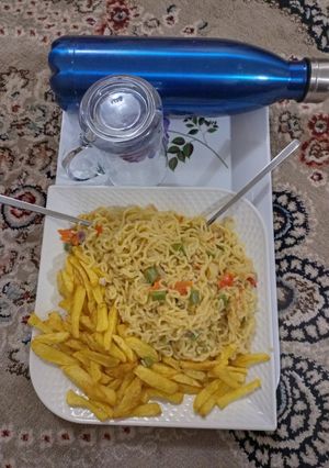 A picture of Indomie noodles and potatoes chips.