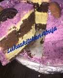Easy Chocolate And Vanilla Birthday Cake with purple frosting