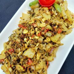 A picture of Creamy (Bitter Gourd) Seeds & Peels with Potatoes.