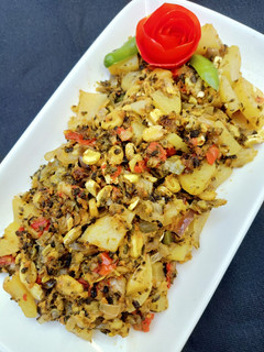 A picture of Creamy (Bitter Gourd) Seeds & Peels with Potatoes.