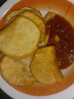 A picture of Fried yam with sauces.