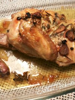 Una foto de Pollo al ajillo y romero al horno