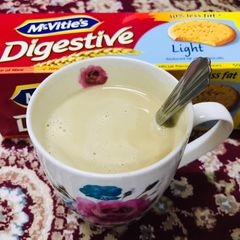 A picture of A hot cup of coffee with Nescafé gold.