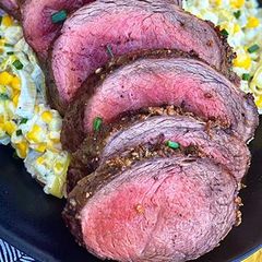 A picture of Garlic-Rubbed Wagyu Teres Major Roast with Creamed Leeks and Corn.