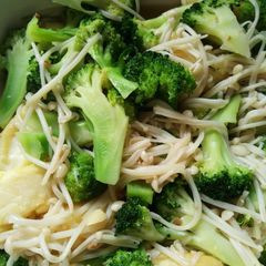 A picture of Broccoli with enoki mushroom and egg tofu.