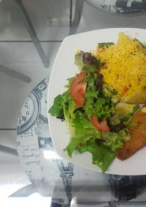 A picture of Baked veggies potato spud and salad.