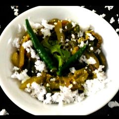 A picture of Brinjal and potato fry with coconut.