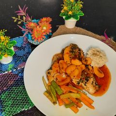 A picture of Chicken steaks with spicy mexican sauce.