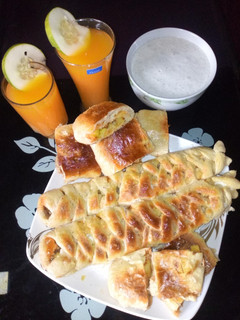 A picture of Caterpillar bread,ginger juice with mango and fura.