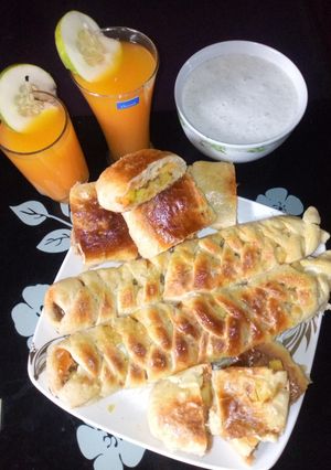 A picture of Caterpillar bread,ginger juice with mango and fura.