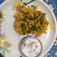 A picture of Tomato pulavu with raitha (Tomato pulao with raita recipe in tamil).