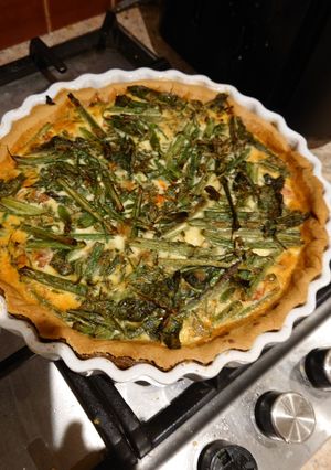 A picture of French Bean, spininch & roast tomato quiche.
