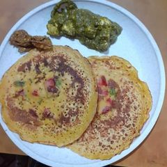 A picture of Besan Chilla/ Tomato Omellete.