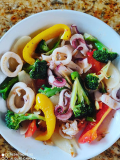 A picture of Stir-Fried Squid with Bell Peppers and Broccoli 🥦.