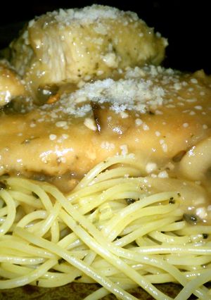 A picture of Chicken Marsala over Pasta.