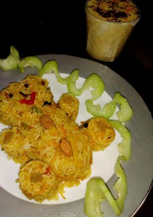 A picture of Soya chaap pullav with coconut veg shot.