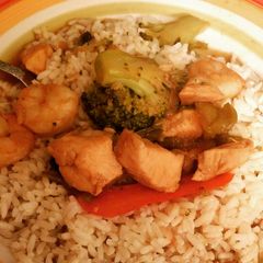 A picture of Chicken, Shrimp, Broccoli & Peppers over Rice .