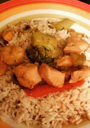 A picture of Chicken, Shrimp, Broccoli & Peppers over Rice .