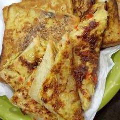 A picture of Fried egg with bread.