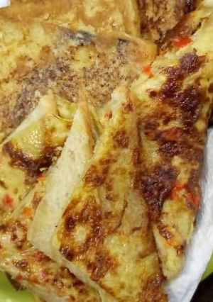 A picture of Fried egg with bread.